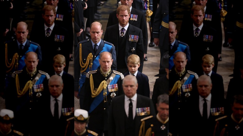 Prince Harry walking behind Prince William and Prince George