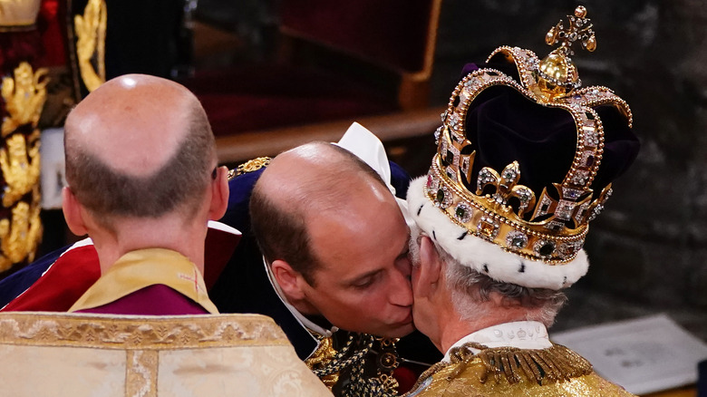 Prince William kissing King Charles on cheek