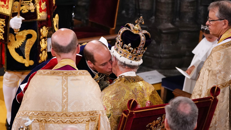 Prince William kissing King Charles at coronation 