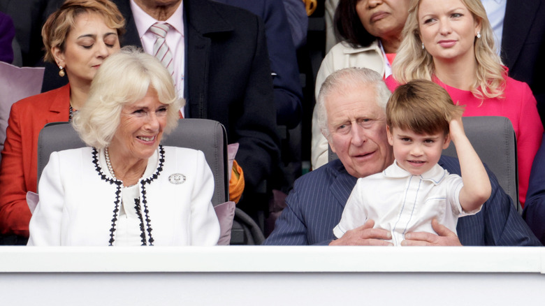 King Charles with Prince Louis on his lap 