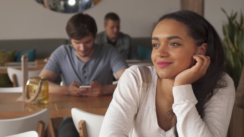 woman smiling slightly