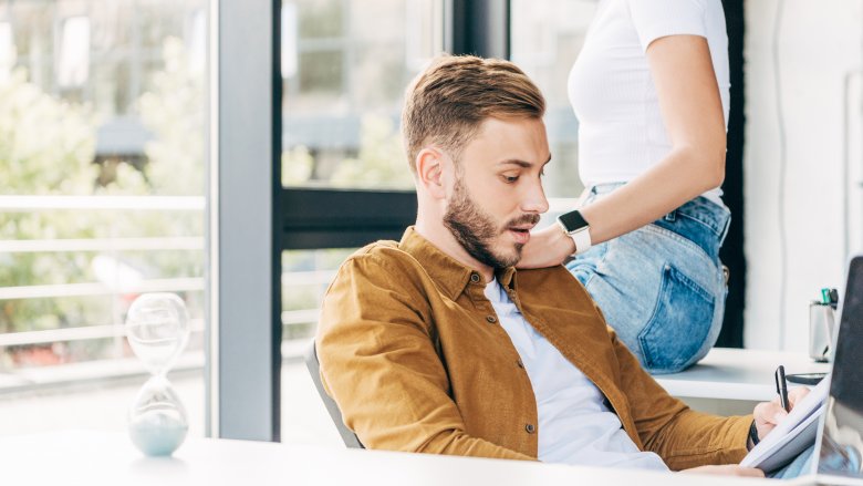 woman touching man's shoulder