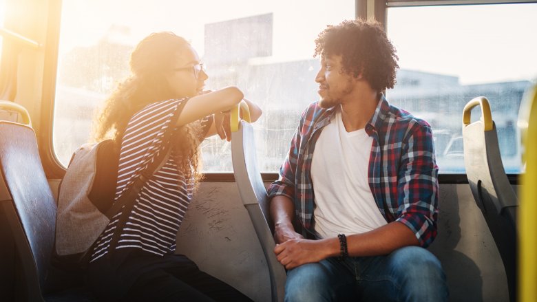 woman turned toward man while talking