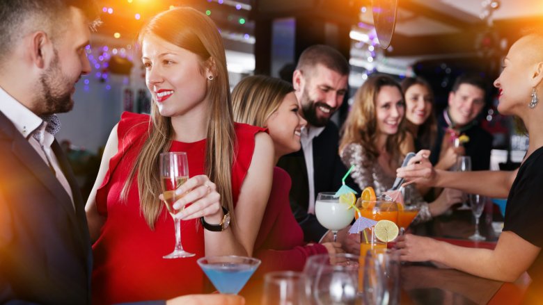 woman flirting with man at bar