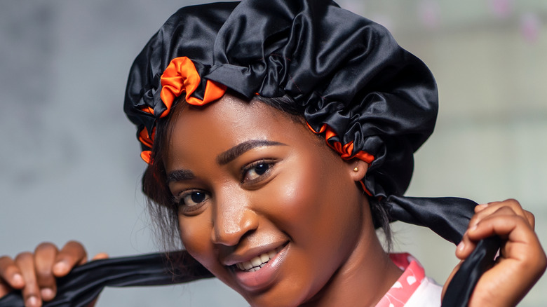 Woman wearing a silk bonnet