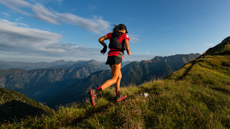 Woman running on a mountain