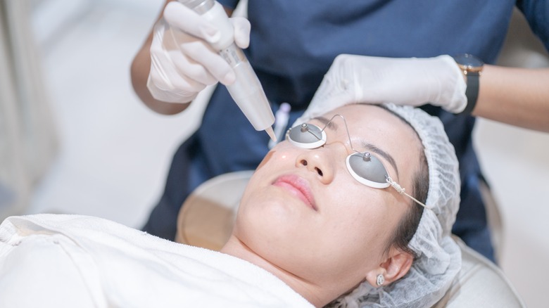 woman getting facial treatment