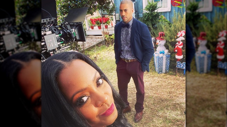 Keshia Knight Pulliam and Brad James standing outside