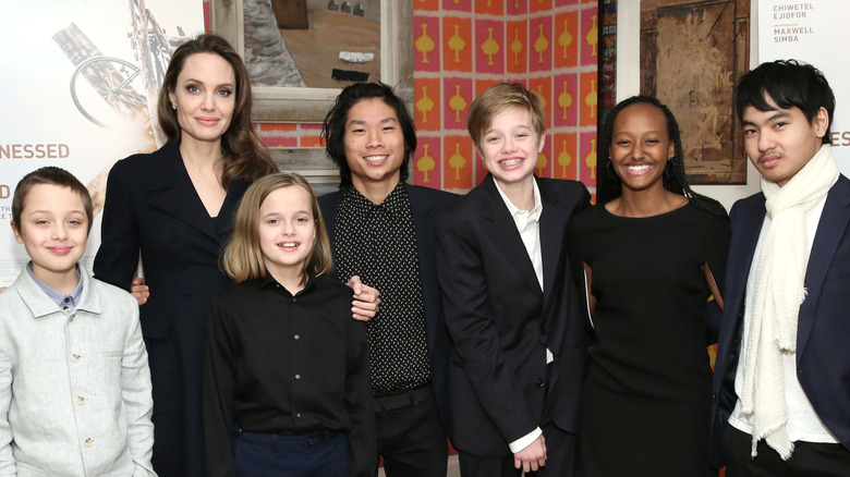 Angelina Jolie posing with her kids