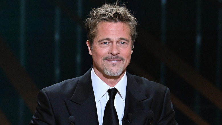 Brad Pitt speaking in suit