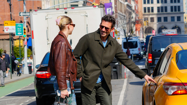 Bradley Cooper and Gigi Hadid getting in a cab