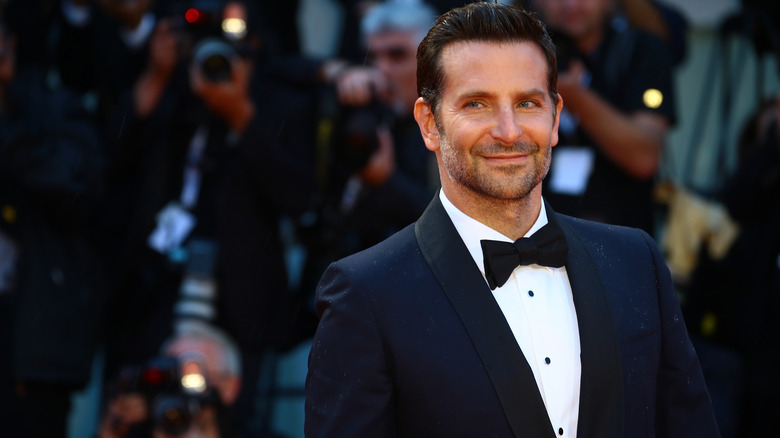 Bradley Cooper smiles at red carpet event