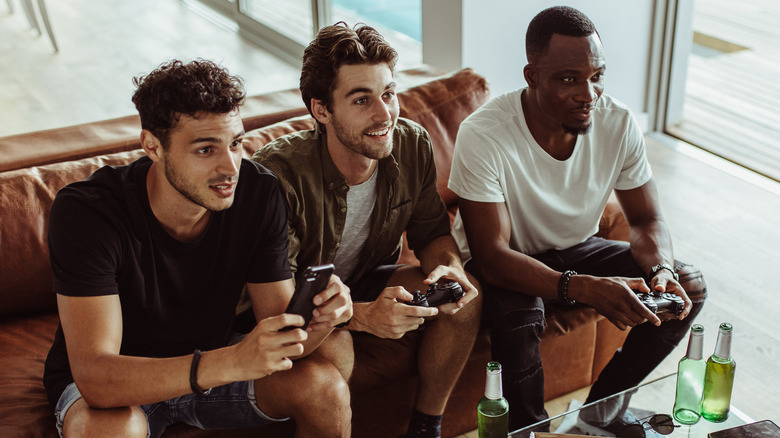 young men playing video games