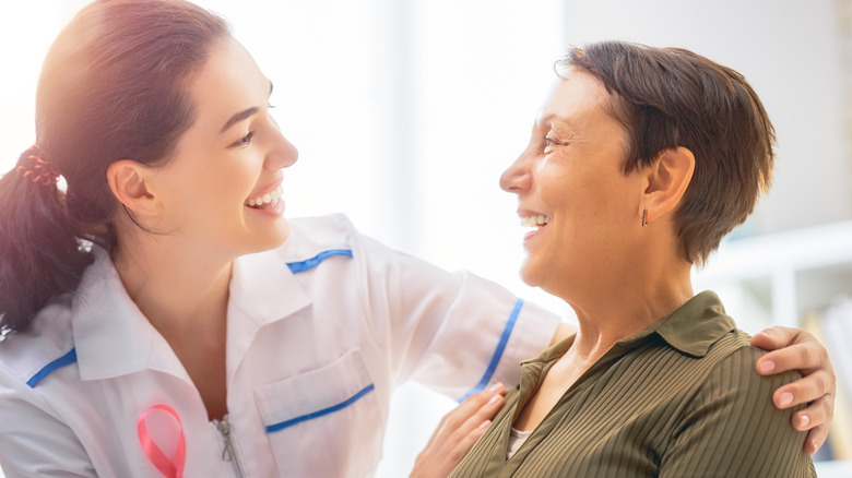 Doctor speaking with woman about breast cancer