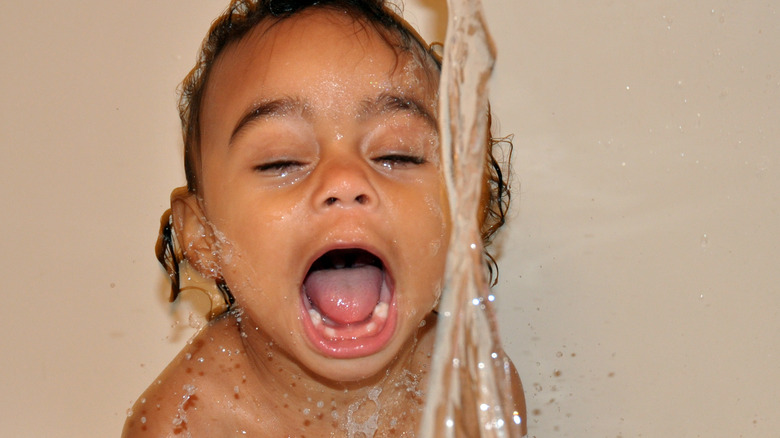 baby playing in bath