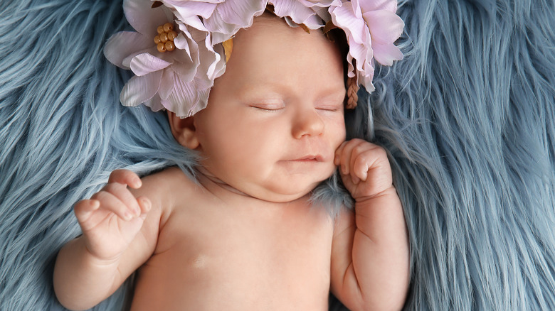 baby with flower headband