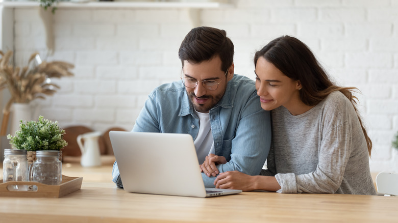 Couple looking at a computer together