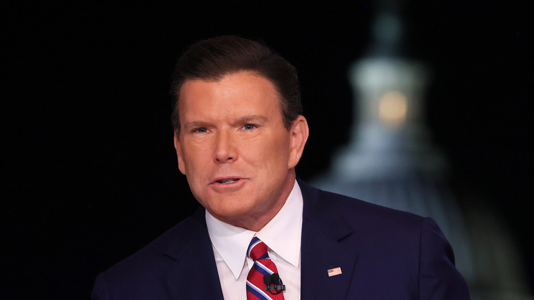 Bret Baier in navy suit and red striped tie