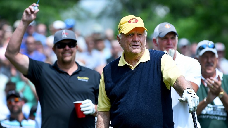 Brett Favre and Toby Keith behind Jack Nicklaus