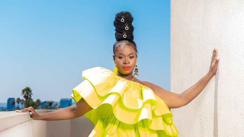 Bria Henderson posing in yellow dress