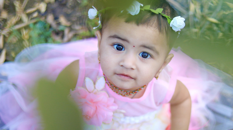 little girl in pink dress and flower crown