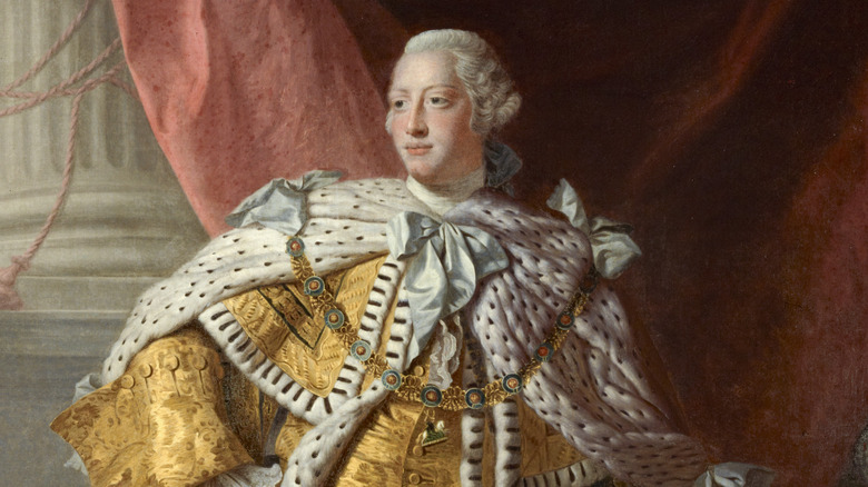 A painted portrait of George III in robe and garland 