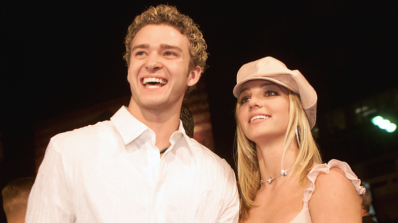 Justin Timberlake and Britney Spears smiling at an event