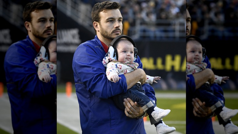 Charlie Ebersol holding his daughter