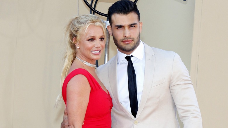 Sam Asghari and Britney Spears posing for photos