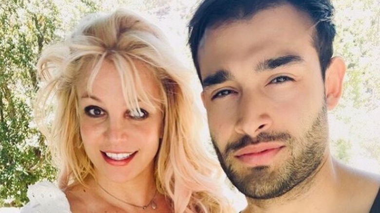 Britney Spears and Sam Asghari smilng