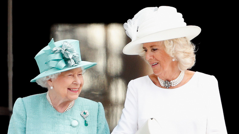 Queen Elizabeth and Camilla Parker Bowles posing