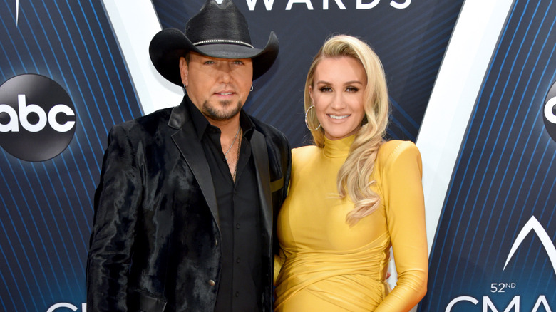 Jason Aldean posing with Brittany Kerr Aldean