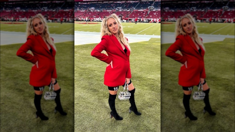 Brittany Mahomes posing on sidelines