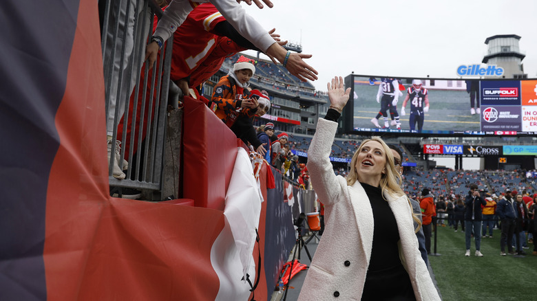 Brittany Mahomes high-fiving fans