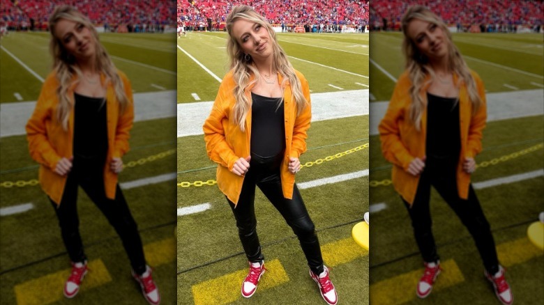 Brittany Mahomes posing on sidelines