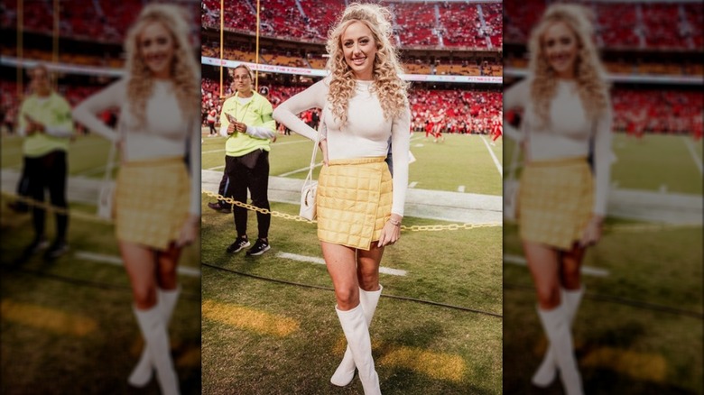 Brittany Mahomes posing on a football field in October 2023