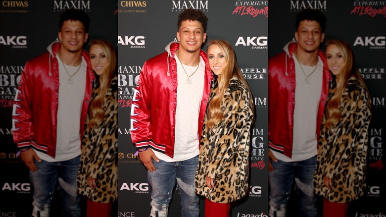 Patrick and Brittany Mahomes posing at The Maxim Big Game Experience in 2019.