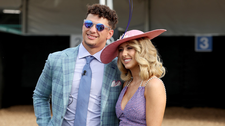 Brittany and Patrick Mahomes smiling at the Kentucky Derby in 2023