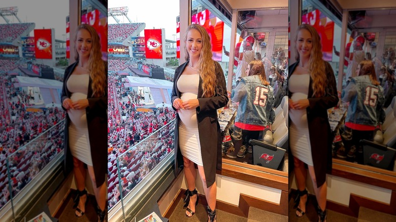 Pregnant Brittany Mahomes posing in private viewing box at Kansas City Chiefs game