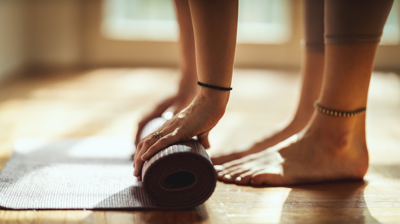 Rolling a yoga mat