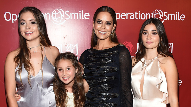 Brooke Burke smiling with daughters