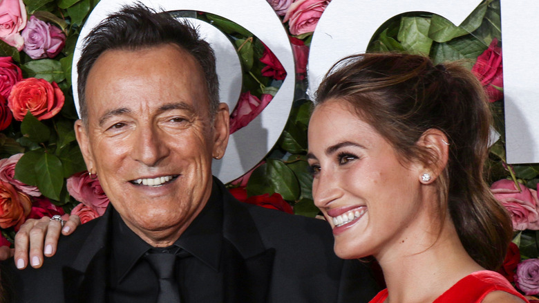 Jessica Springsteen poses with her father on the red carpet