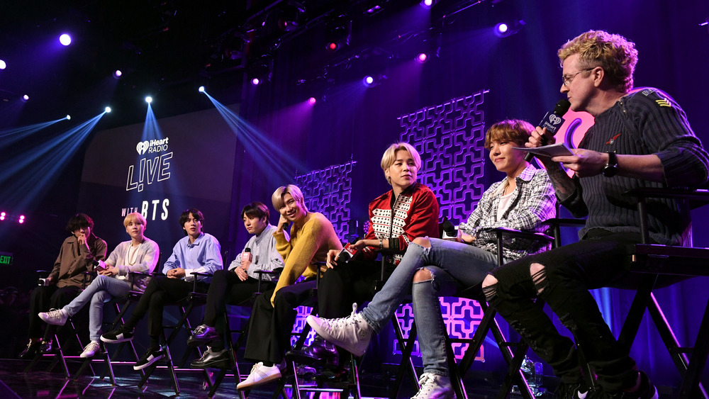 BTS on stage at an iHeart Radio event 