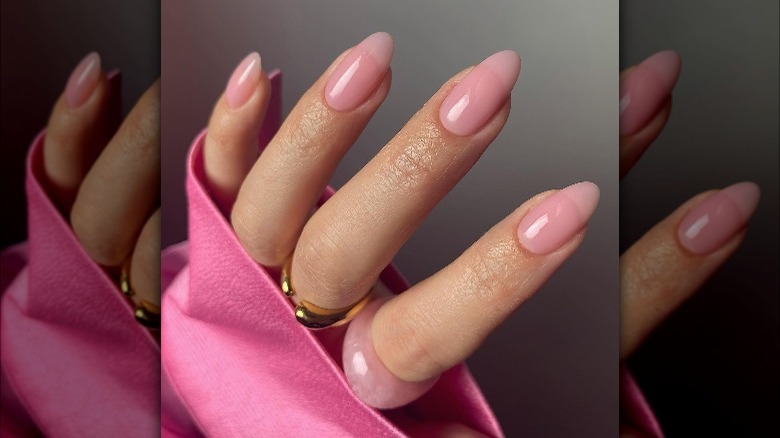 Glossy pink nails with a point