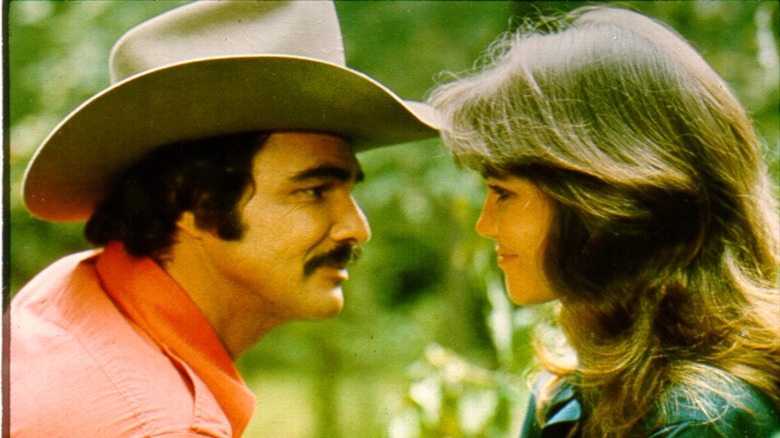 Burt Reynolds and Sally Field looking at each other