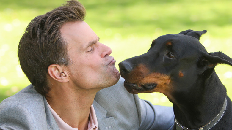 Cameron Mathison kissing his dog Red