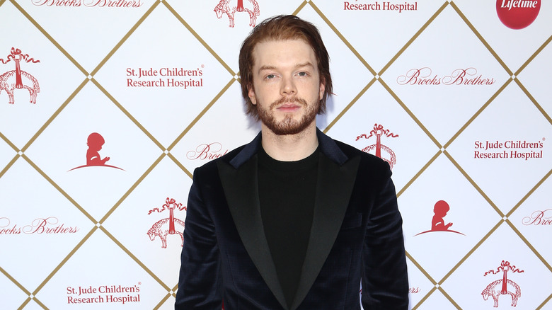 Cameron Monaghan posing at event