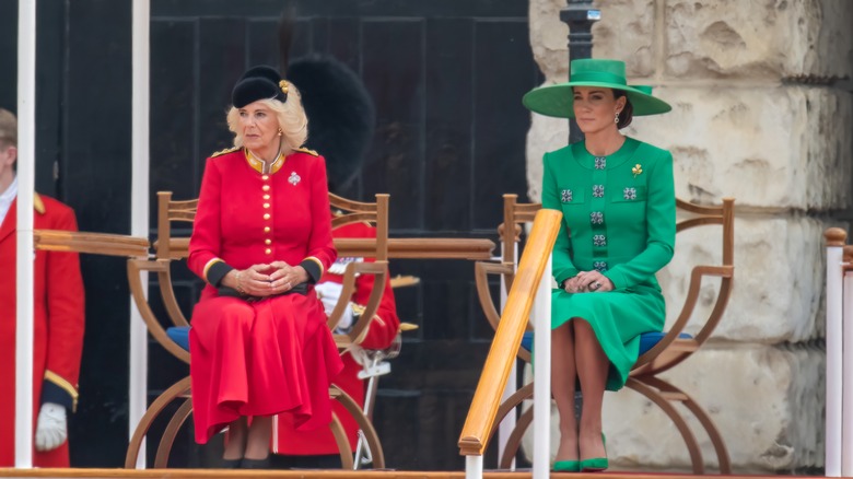 Camilla, Queen Consort sits with Catherine, Princess of Wales