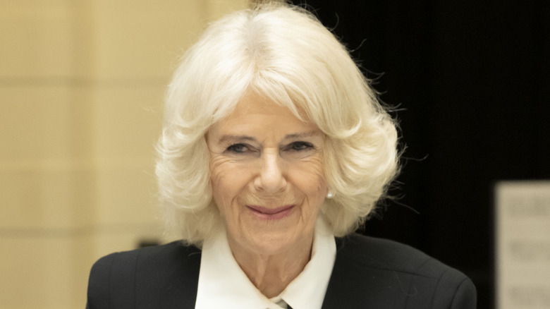 Camilla Parker Bowles smiling with mouth closed