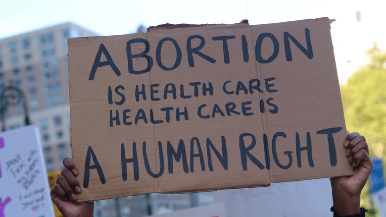 pro-abortion protestors holding signs and marching